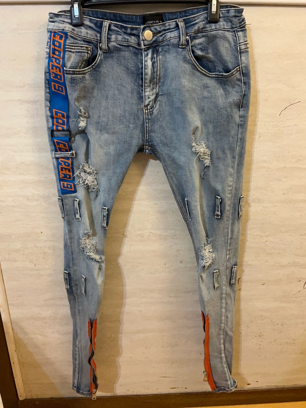 Cooper 9 Los Angeles. Distressed, light-wash denim streetwear jeans
